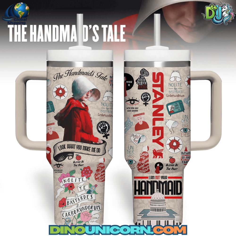 The Handmaids Tale Stanley Tumbler Cup The Handmaid's Tale Stanley Tumbler Cup featuring a red-cloaked handmaid, iconic quotes, feminist symbols, and themed illustrations, with dual handles and straw lid.